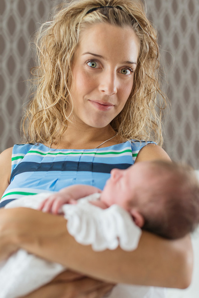 Mother holding a newborn girl - Photo, Image