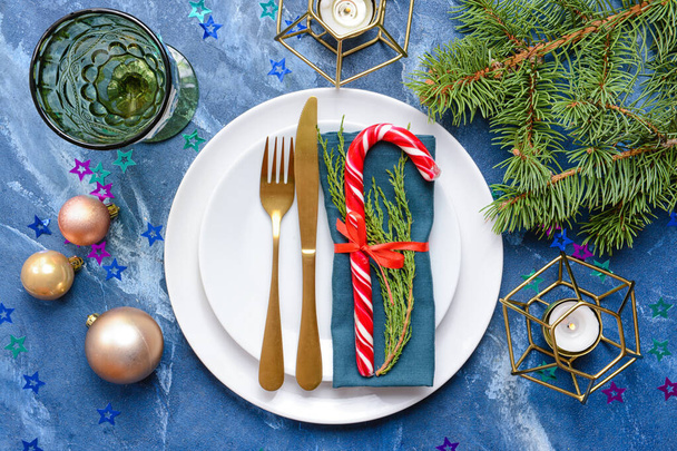 Beautiful Christmas table setting on color background - Фото, изображение