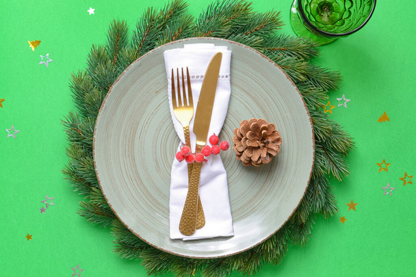 Beautiful Christmas table setting on color background - Fotoğraf, Görsel