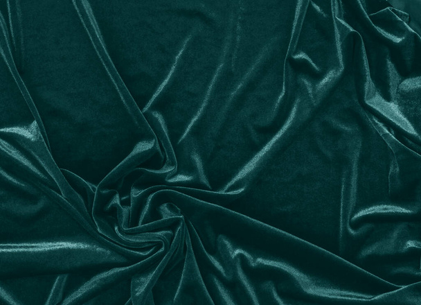 Draped velvet fabric in trendy green color. Abstract modern background - Photo, Image