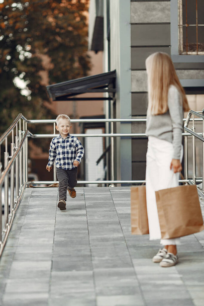 Cute family with a shopping bag - Foto, imagen