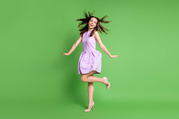 Full length body size view of her she nice-looking attractive pretty slender fashionable glad cheerful cheery girl posing having fun enjoying holiday good mood isolated green color background - Fotografie, Obrázek