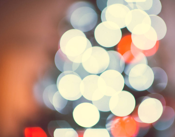 Photo of defocused colorful bokeh lights on christmas tree at new years tree - Valokuva, kuva