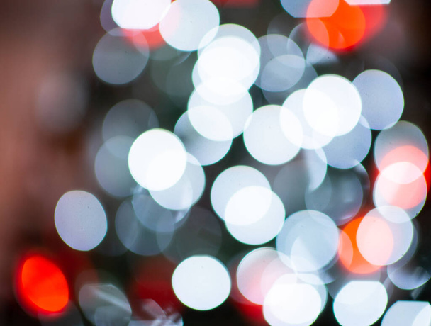 Photo of defocused colorful bokeh lights on christmas tree at new years tree - Valokuva, kuva