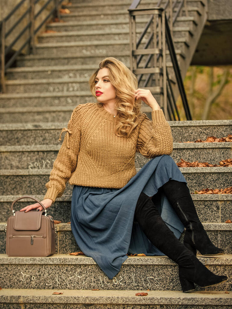 perfect female. female beauty. Fashion model. girl in corrugated skirt and sweater. Pleated trend. autumn woman curly hair outdoor. girl long blond hair stairs. casual style student. fall season - Foto, Imagen