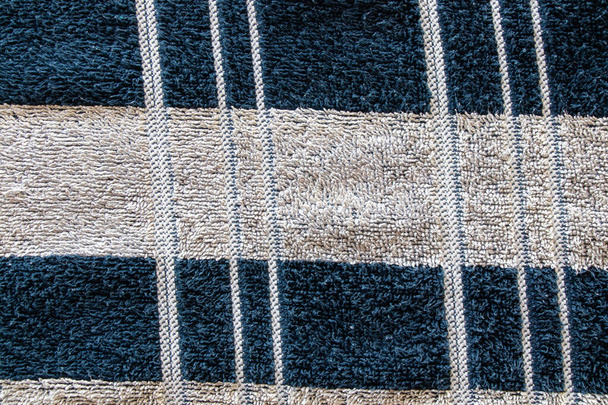 men's striped towel in white and black stripes for a shower as a background close-up - Φωτογραφία, εικόνα