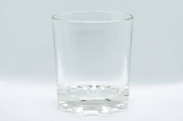 Glass on light background with selective focus - Foto, imagen