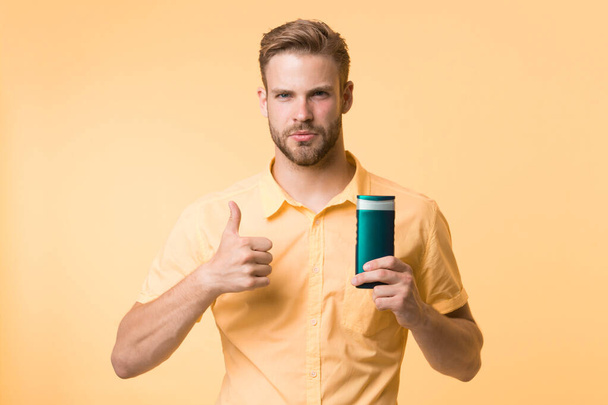 Facial care. Male fashion. caucasian guy with moustache. Mature hipster with beard. Bearded man. man on yellow background. presenting product. hair care and health - Φωτογραφία, εικόνα