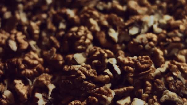 Walnut macro. Product rich in minerals and vitamins. Walnut kernels falling in stack in the process of production. 4K video - Footage, Video