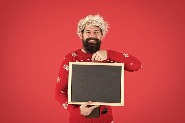 Event promotion. Christmas event. Invitation concept. Winter announcement. Winter event. Bearded hipster man blank blackboard copy space. Santa Claus advertisement. Chalkboard for information - Фото, изображение