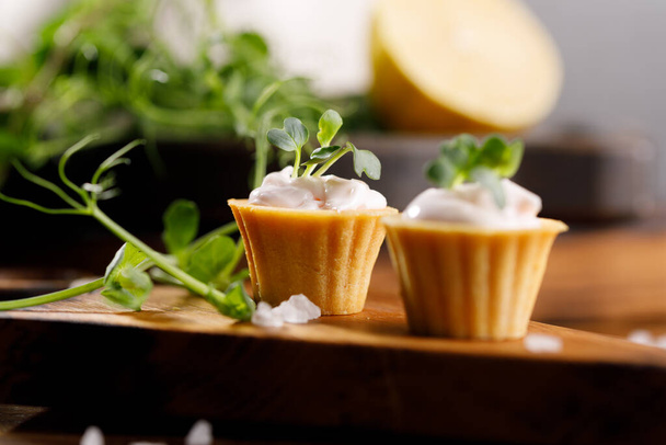 Canapes with light cream filling. Still life with microgreens. The concept of an appetizing snack. Close-up - Foto, Bild