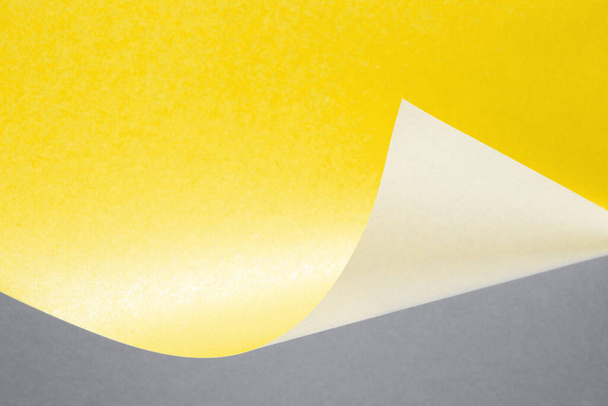 Illuminating yellow and Ultimate Gray curve paper abstract background. - Zdjęcie, obraz