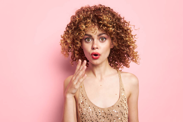 Woman portrait Surprised look of gesticulating with hands curls fashion clothes Copy space - Photo, image