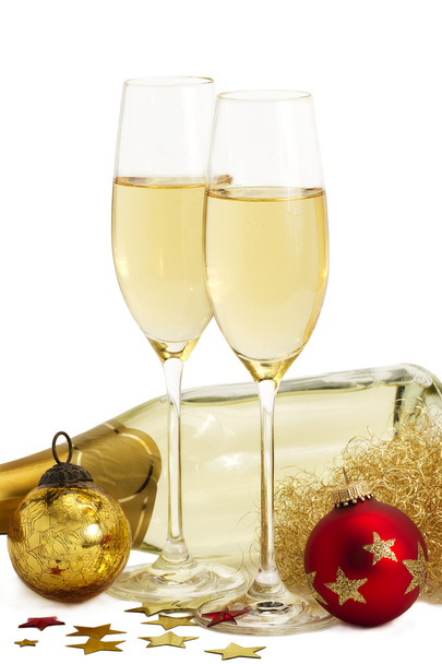 Kaksi lasillista samppanjaa enkeleiden hiukset, punainen ja kultainen joulupallot i
 - Valokuva, kuva