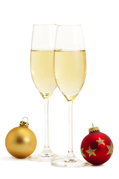 Kaksi lasia samppanjaa ja yksi punainen ja kultainen joulupallot
 - Valokuva, kuva