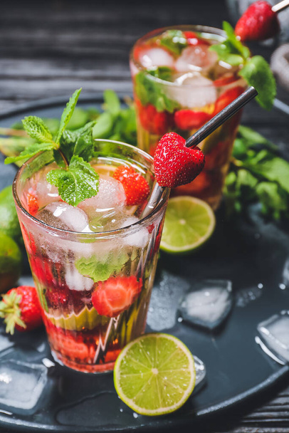 Glasses of fresh strawberry mojito cocktail  on tray - Photo, Image