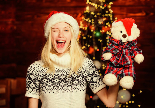 Xmas mood. Woman got teddy bear toy present. Santa hat christmas accessory. Cute gift. Winter holidays celebration. Happy new year. Christmas preparation. All she wants for christmas. Cheerful woman - Zdjęcie, obraz