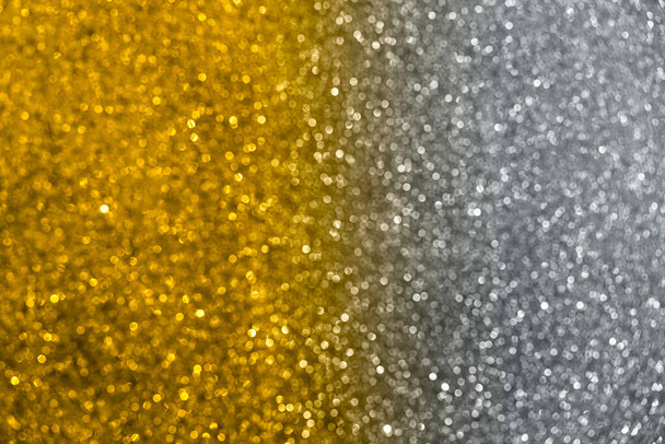 Blurred abstract glitter texture, defocused christmas lights in colors of 2021 year. Holiday or christmas concept. - Photo, Image