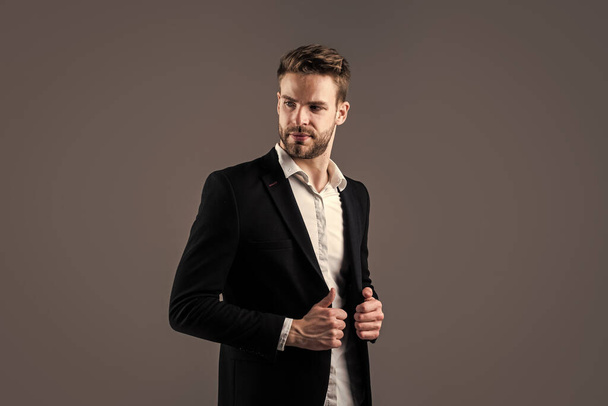 Portrait of a handsome CEO. Businessman in suit. Young handsome man. Young manager in his office. portrait of a businessman on grey background. confident businessman portrait - Fotografie, Obrázek