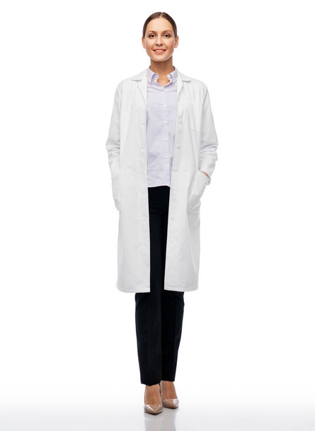 smiling female doctor or scientist in white coat - Zdjęcie, obraz