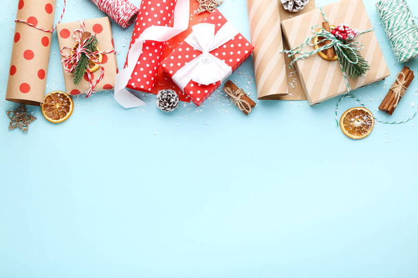 Gift boxes with ornaments on blue background - Foto, Imagen