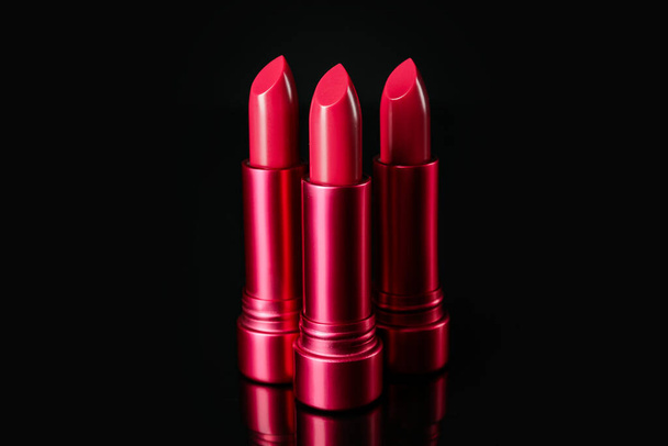 Lipsticks on black background - Valokuva, kuva