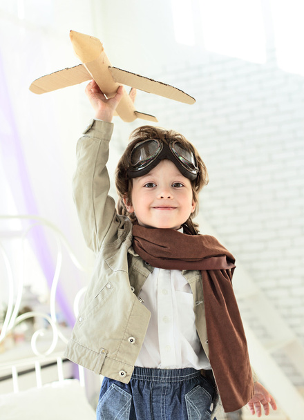 Happy boy with jet airplane in hand - Foto, Imagem