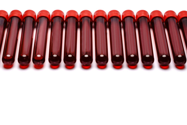Test tubes with red plug isolated on white background - Фото, зображення