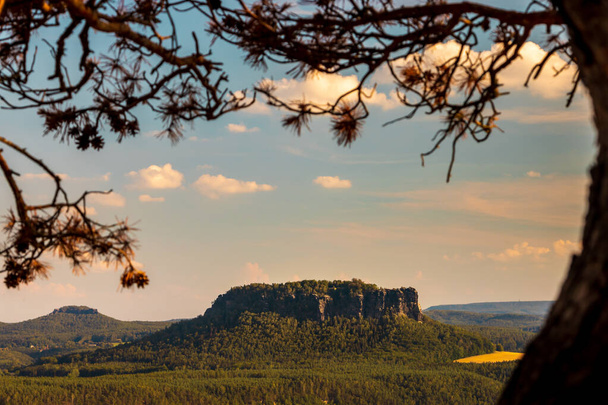 View from the viewpoint of the Bastei to Lilienstein in the heart of the Saxon Switzerland National Park at sunset - Фото, зображення