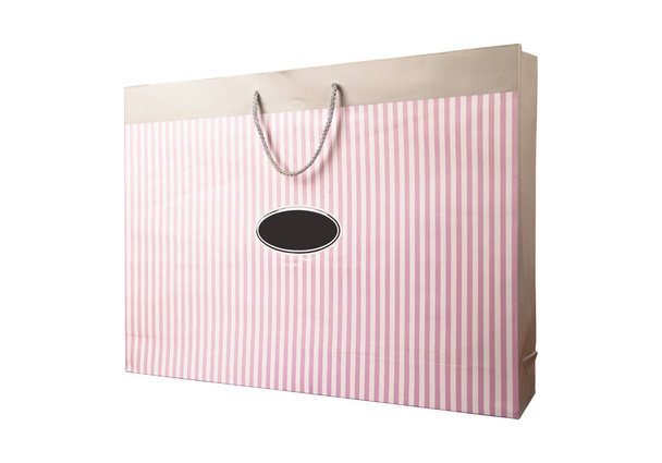 Recycled paper shopping one beige bag on white background. Natural Product. Pink recyclable paper - Zdjęcie, obraz