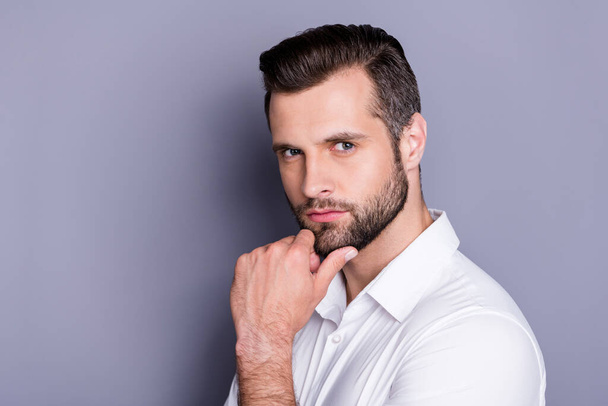 Close-up portrait of his he nice attractive virile brutal brunet guy model unshaven beard posing touching chin thinking isolated over gray pastel color background - Φωτογραφία, εικόνα