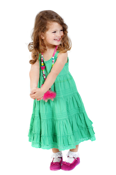 usmíval se roztomilá holčička s zelené šaty  - Fotografie, Obrázek