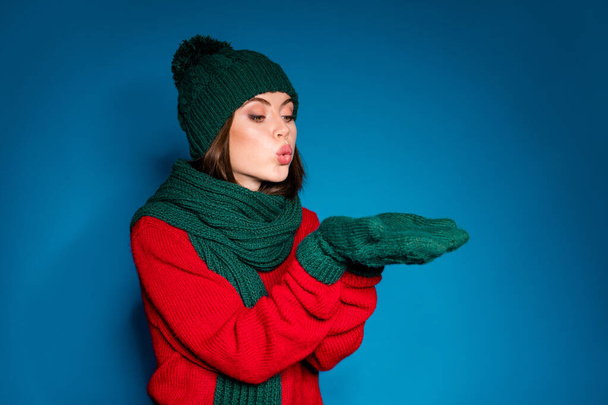 Photo of comfort cozy girl in woolen hat gloves hold hand blow winter x-mas atmosphere spirit snowy snow flakes wear pullover isolated over gradient blue color background - Φωτογραφία, εικόνα