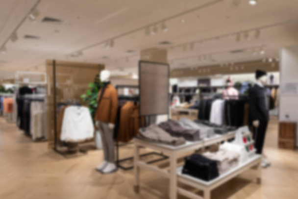 blur photo: luxury and fashionable brand new interior of cloth store - Photo, Image