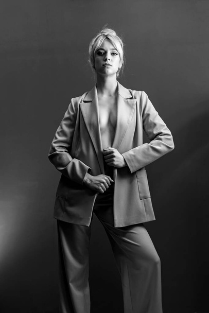 Sexy young blonde, a jacket dressed on a naked body. - Photo, image