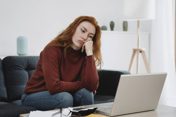Depressed woman broke after calculating home bills - Фото, изображение