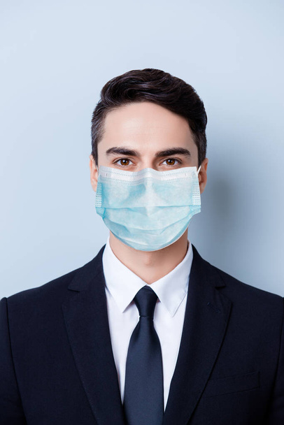 Vertical close-up portrait of classy expert guy wearing gauze safety mask disease prevention isolated on blue color background - Фото, зображення