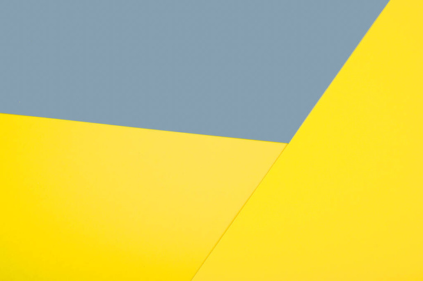 Streszczenie powierzchni tekstury papieru. Prezentacja Trendujących Kolorów Roku 2021 - żółty i szary. Wysokiej jakości zdjęcie - Zdjęcie, obraz