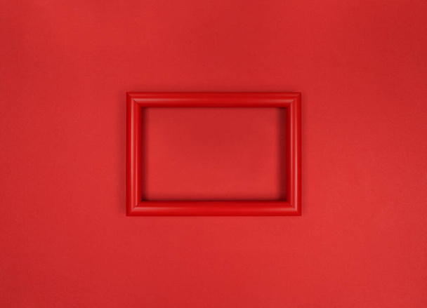 Frame on the wall, minimalistic red monochrome photo. - Foto, imagen