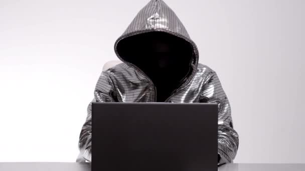 Computer hacker in silver jacket - Footage, Video