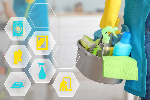 Female janitor with supplies and cleaning service icons - Photo, Image