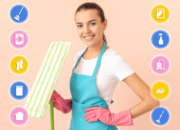 Female janitor with mop and cleaning service icons on color background - Photo, Image