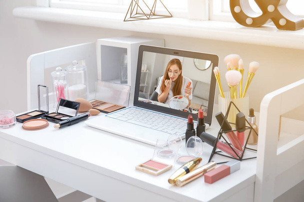 Workplace of professional makeup artist with modern laptop - Fotografie, Obrázek
