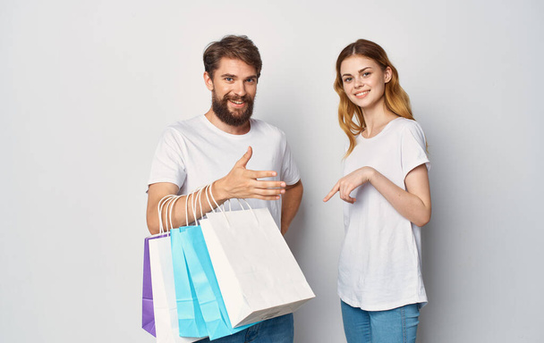 young couple with bags in their hands Shopping fun - Photo, Image
