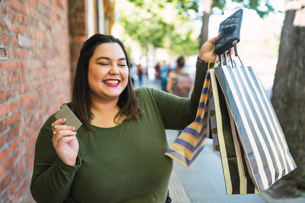 Young woman doing shopping with credit card. - Fotó, kép