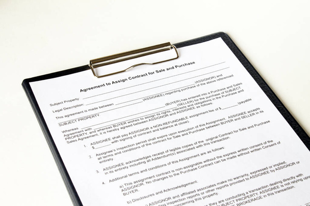 Contract papers on folder lies on a white background. Business concept photo - Foto, afbeelding