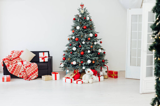 The interior of the white room Christmas tree New Year holiday gifts decor - Fotoğraf, Görsel