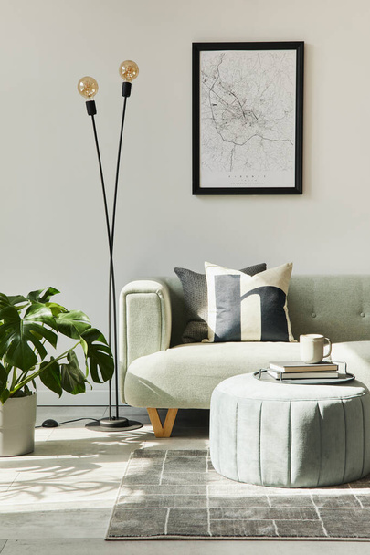 Stylish loft interior with green sofa, design pouf, mock up poster map, furniture,  carpet, plants, decoration and elegant accessories. Modern home decor. Template. - Foto, Imagem
