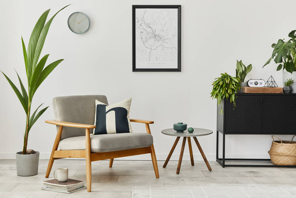 Modern retro concept of home interior with design grey armchair, coffee table, plants, mock up poster map, carpet and personal accessoreis. Stylish home decor of living room. - Foto, afbeelding