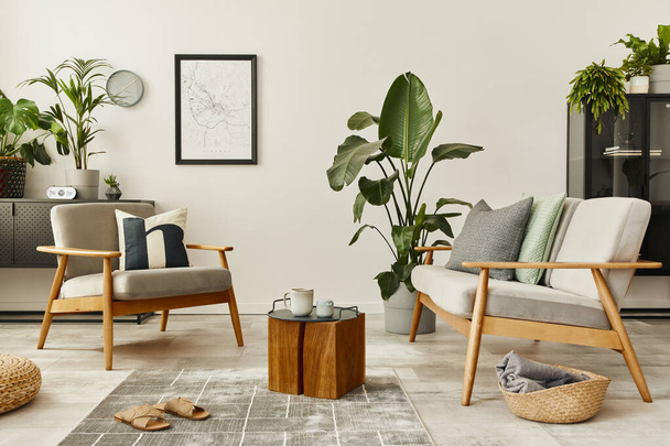 Modern retro concept of home interior with design sofa, armchair, coffee table, plants, mock up poster map, carpet and personal accessoreis. Stylish home decor of living room. - Fotoğraf, Görsel